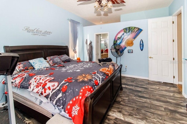 bedroom featuring ceiling fan and dark hardwood / wood-style floors