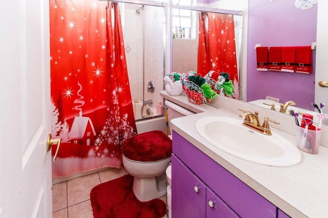 full bathroom featuring tile patterned flooring, vanity, toilet, and shower / bath combo with shower curtain