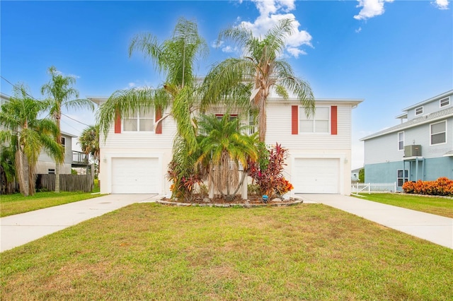 view of front of house featuring a front yard and a garage