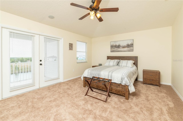 bedroom with a ceiling fan, access to outside, light colored carpet, and baseboards