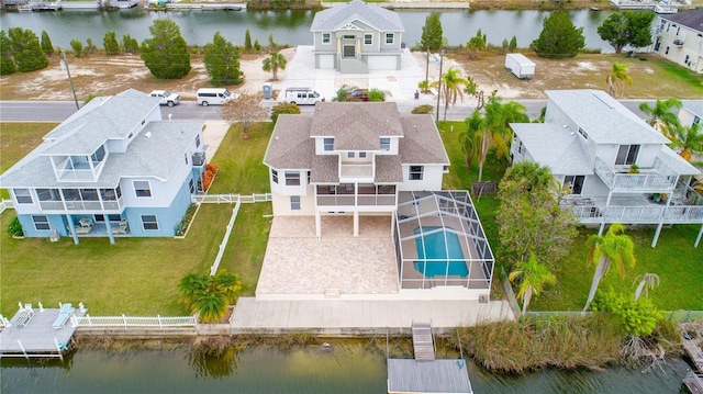 bird's eye view featuring a water view and a residential view