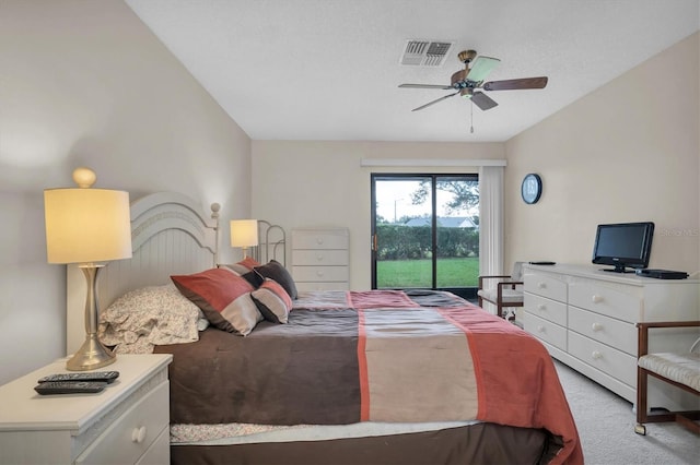 carpeted bedroom featuring access to exterior and ceiling fan