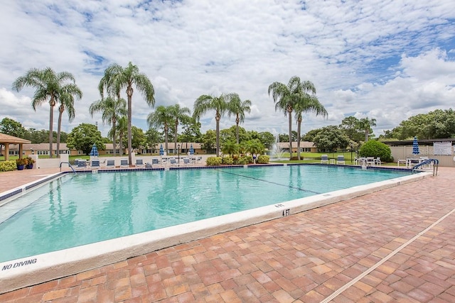 view of swimming pool featuring a patio area