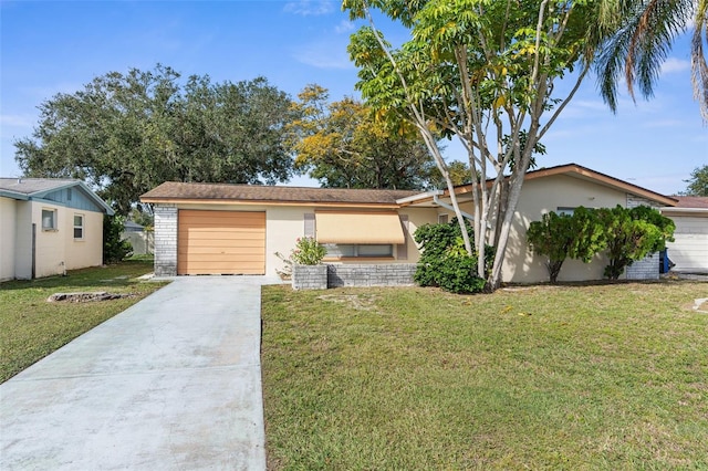 ranch-style home featuring a garage and a front lawn