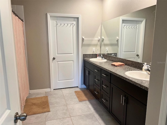 bathroom with tile patterned flooring and vanity