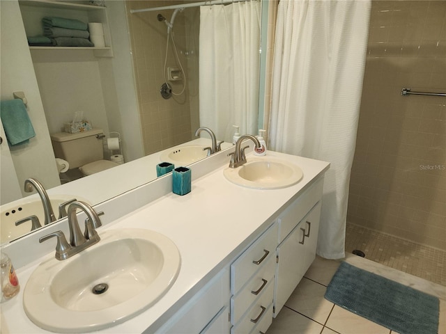 bathroom featuring tile patterned floors, a shower with curtain, toilet, and vanity