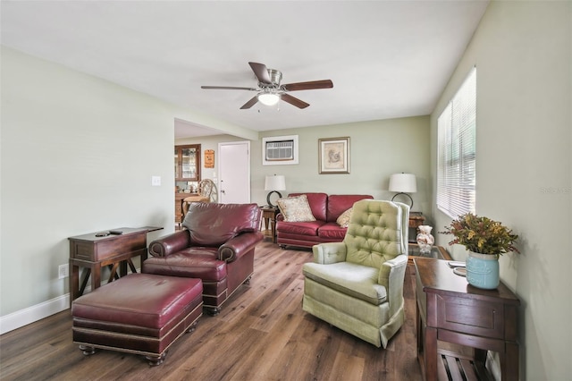 living room with ceiling fan and dark hardwood / wood-style floors