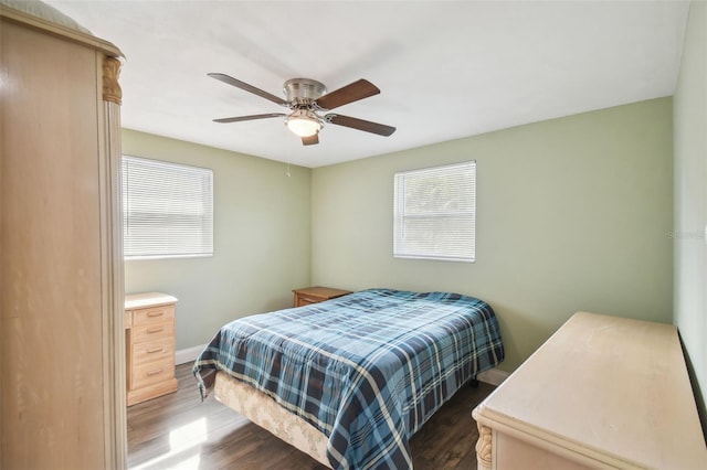 bedroom featuring ceiling fan and dark hardwood / wood-style floors