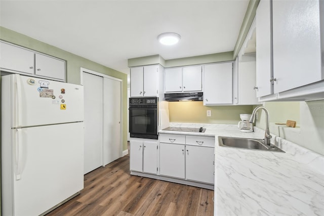 kitchen with white cabinetry, sink, black appliances, and dark hardwood / wood-style flooring