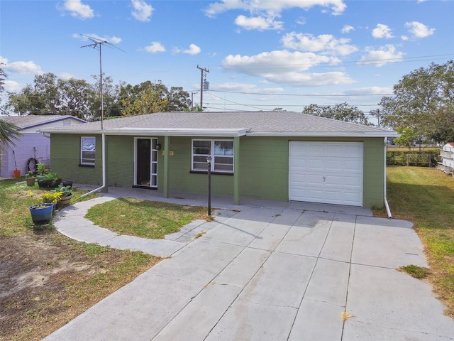 single story home with covered porch, a garage, and a front lawn