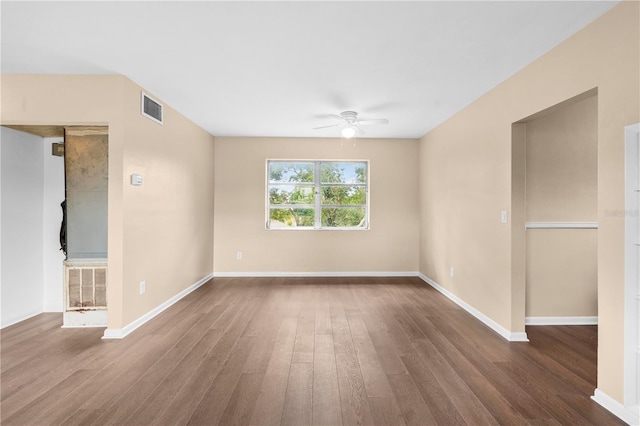 spare room featuring wood-type flooring and ceiling fan