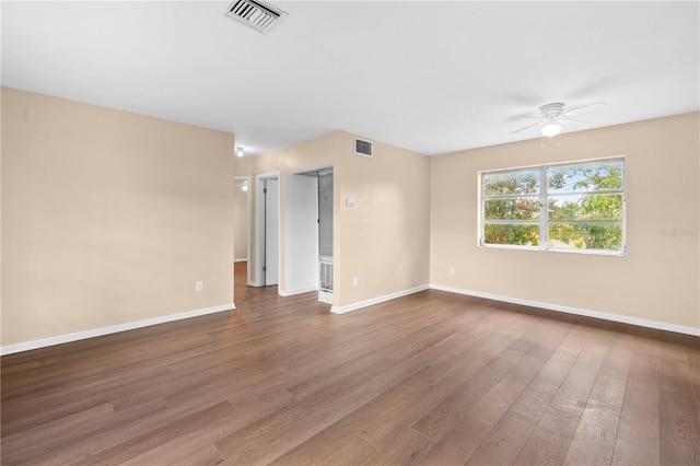 spare room with hardwood / wood-style flooring and ceiling fan