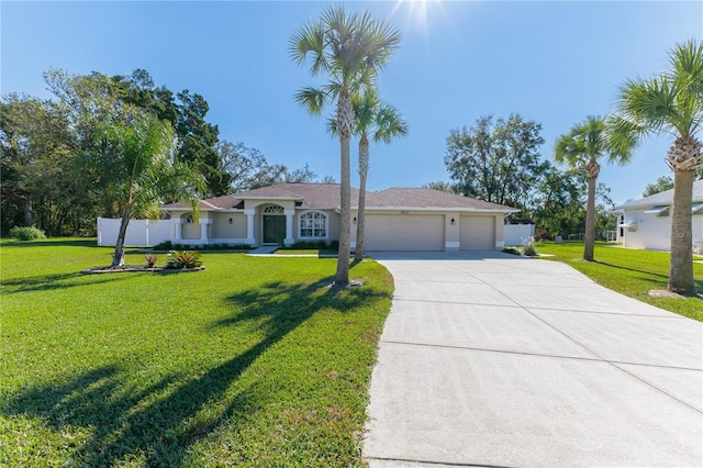 single story home featuring a front lawn and a garage