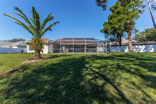 view of yard with a lanai