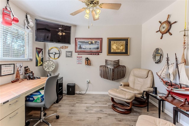 office space with ceiling fan and light hardwood / wood-style floors