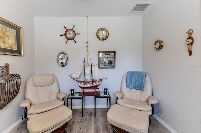 sitting room featuring hardwood / wood-style floors