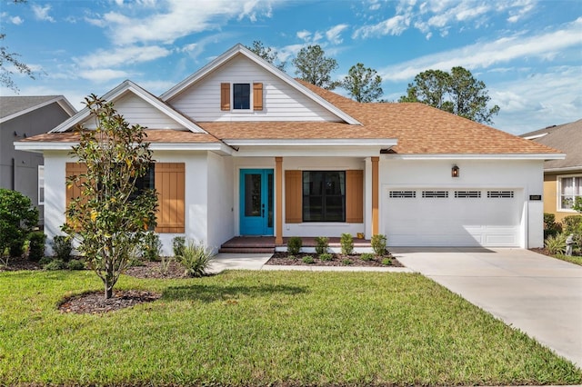 view of front facade featuring a garage and a front yard