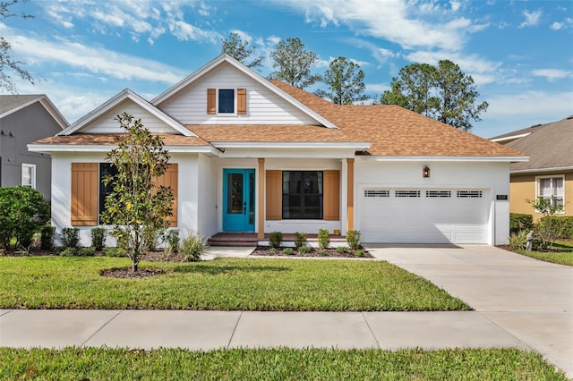 view of front of home with a garage and a front yard