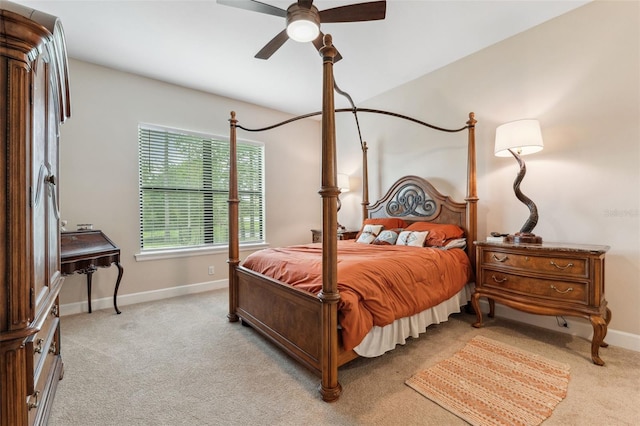 bedroom featuring light carpet and ceiling fan