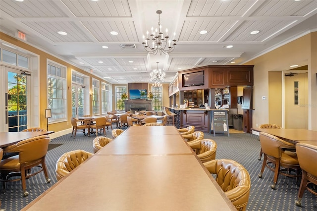 carpeted dining area featuring beamed ceiling, crown molding, and an inviting chandelier