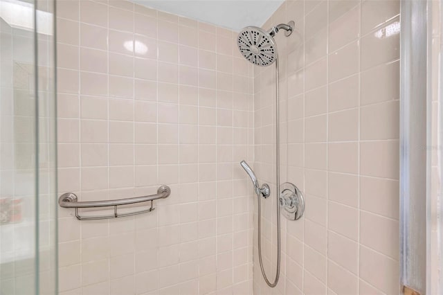 bathroom with a tile shower