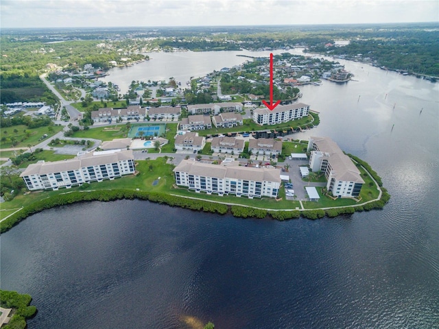 birds eye view of property with a water view