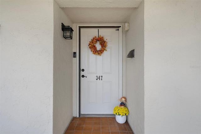 8141 Aquila St Unit 347, Port Richey, FL 34668 - doorway to property with stucco siding
