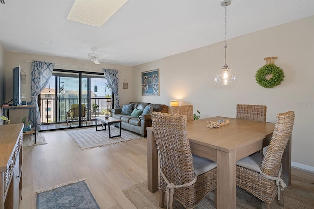 dining room featuring ceiling fan and light hardwood / wood-style flooring