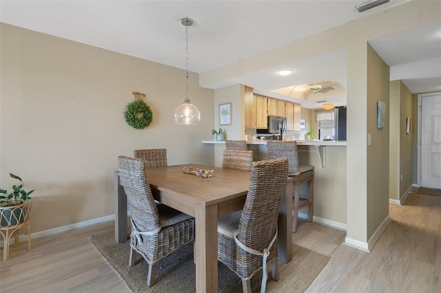 dining room featuring light wood-type flooring