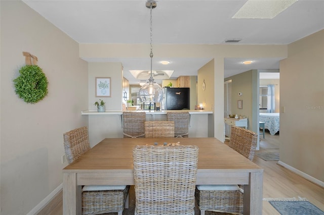dining room featuring light wood-type flooring