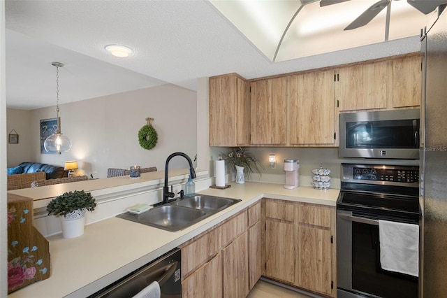 8141 Aquila St Unit 347, Port Richey, FL 34668 - kitchen with appliances with stainless steel finishes, a sink, light countertops, a ceiling fan, and light brown cabinets
