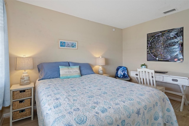 8141 Aquila St Unit 347, Port Richey, FL 34668 - bedroom with wood finished floors and baseboards