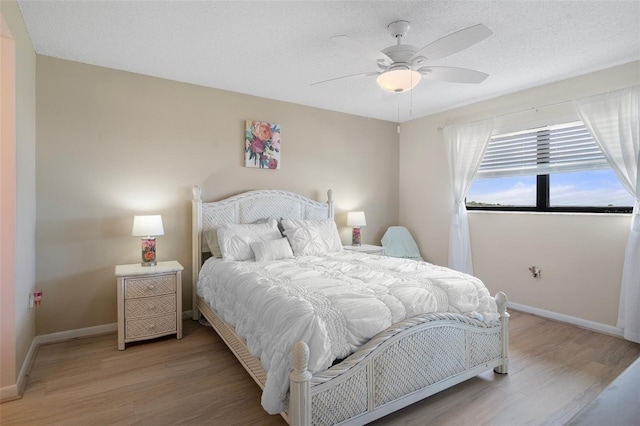 8141 Aquila St Unit 347, Port Richey, FL 34668 - bedroom with light wood-style flooring, baseboards, and ceiling fan