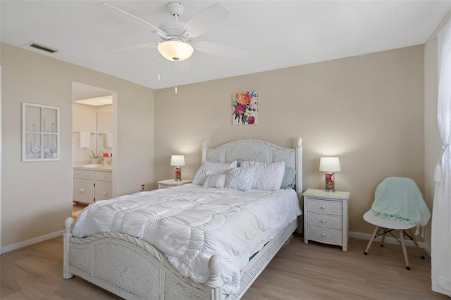 bedroom with connected bathroom, light hardwood / wood-style flooring, and ceiling fan