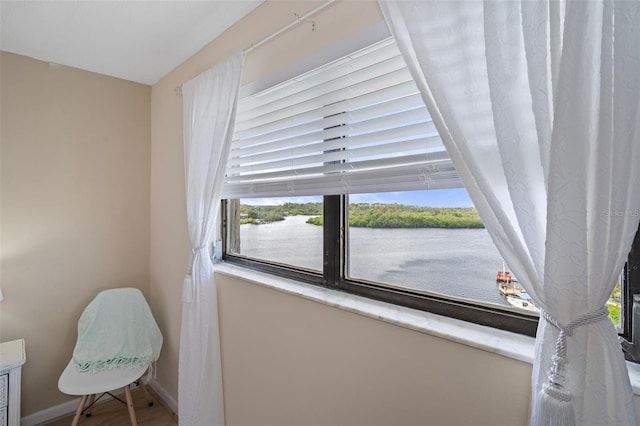 8141 Aquila St Unit 347, Port Richey, FL 34668 - living area with a water view and baseboards