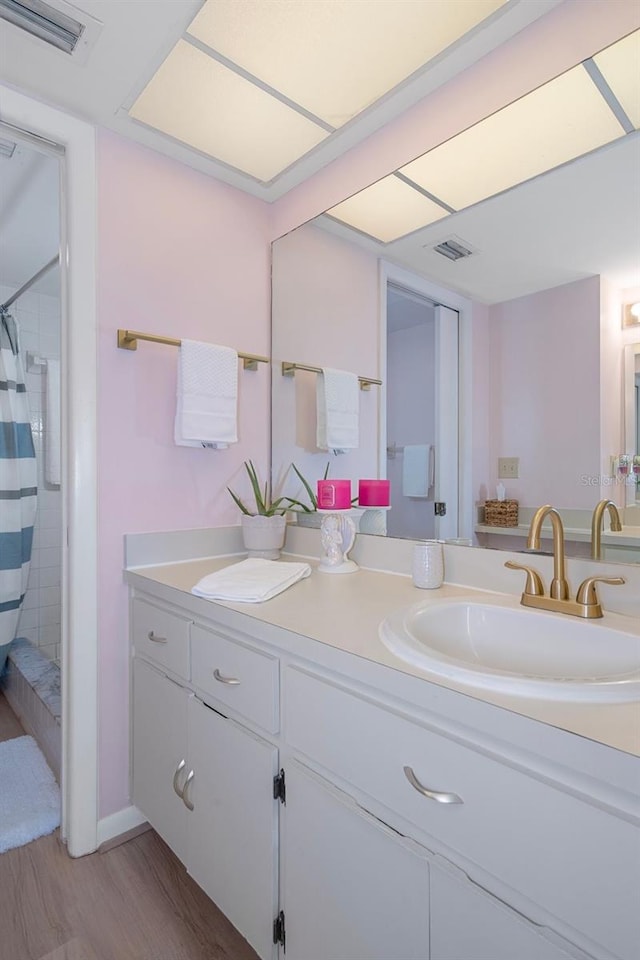 8141 Aquila St Unit 347, Port Richey, FL 34668 - full bathroom with vanity, wood finished floors, and curtained shower