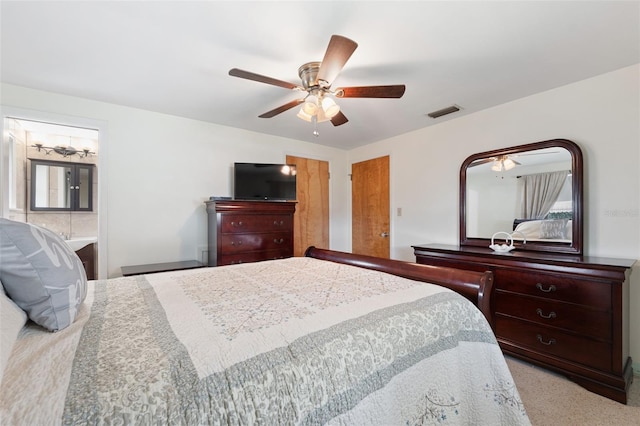 carpeted bedroom with ceiling fan