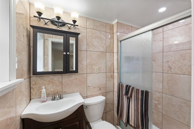 bathroom featuring walk in shower, vanity, tile walls, and crown molding