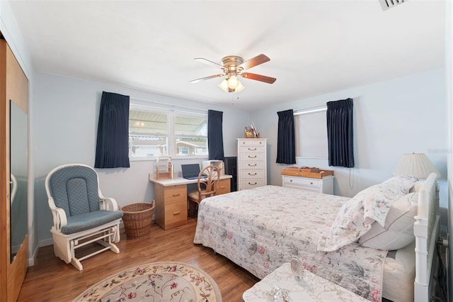 bedroom with ceiling fan and light wood-type flooring