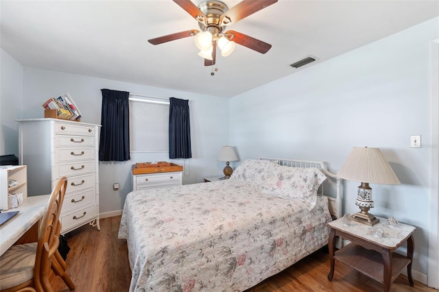 bedroom featuring ceiling fan and dark hardwood / wood-style flooring