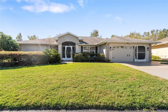 ranch-style home featuring french doors, a garage, and a front lawn