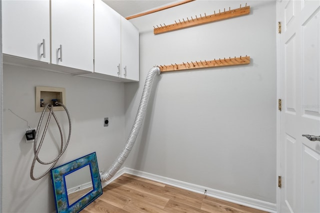 washroom featuring light wood-type flooring, cabinets, hookup for a washing machine, and electric dryer hookup