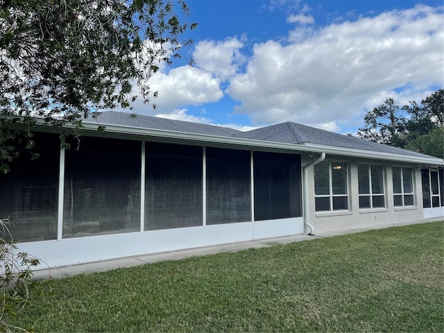 view of home's exterior featuring a lawn