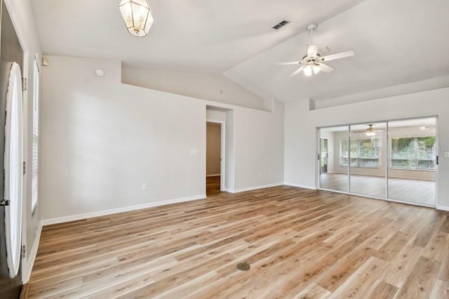 spare room featuring lofted ceiling, ceiling fan, and light hardwood / wood-style flooring