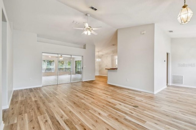 unfurnished living room with ceiling fan, lofted ceiling, and light hardwood / wood-style flooring