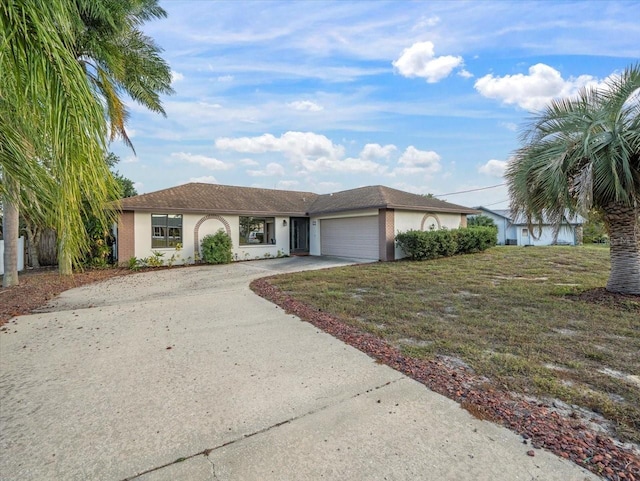 view of front of property featuring a front yard and a garage