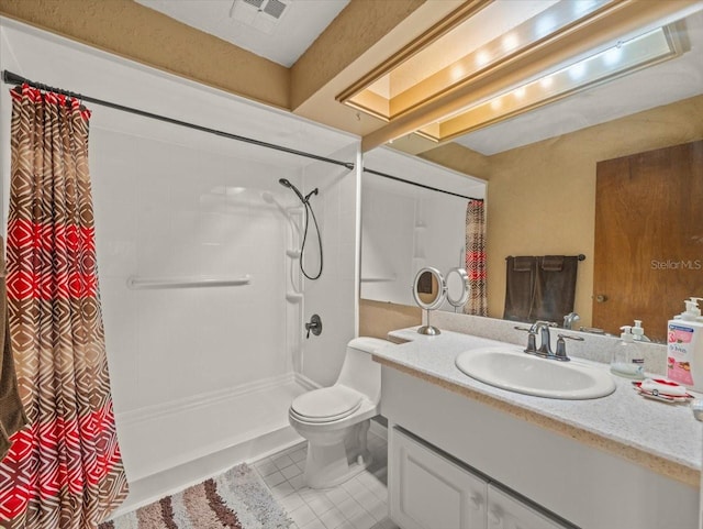 bathroom with tile patterned flooring, vanity, toilet, and a shower with curtain