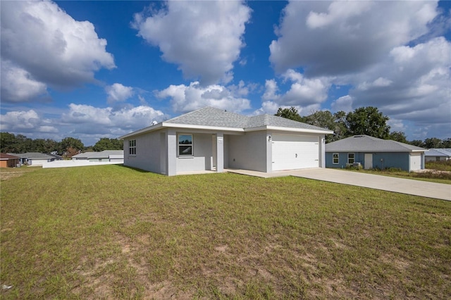 view of front of property featuring a front yard and a garage