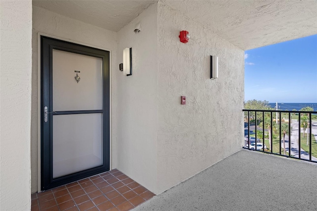 4620 Bay Blvd Unit 1148, Port Richey, FL 34668 - entrance to property with a balcony, stucco siding, and a water view