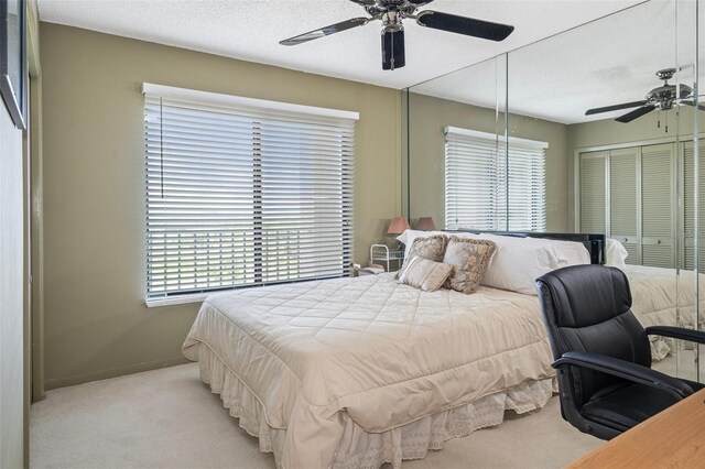 4620 Bay Blvd Unit 1148, Port Richey, FL 34668 - bedroom with light colored carpet, multiple windows, a closet, and a textured ceiling
